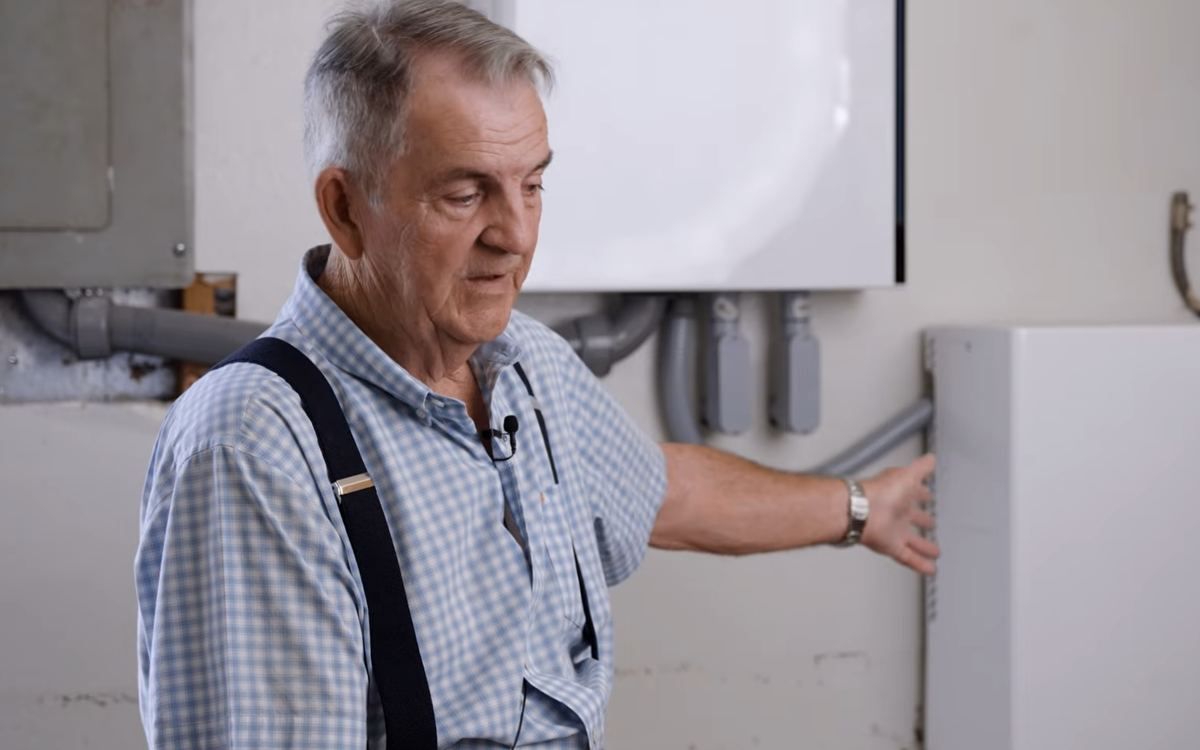 A homeowner next to his FranklinWH battery